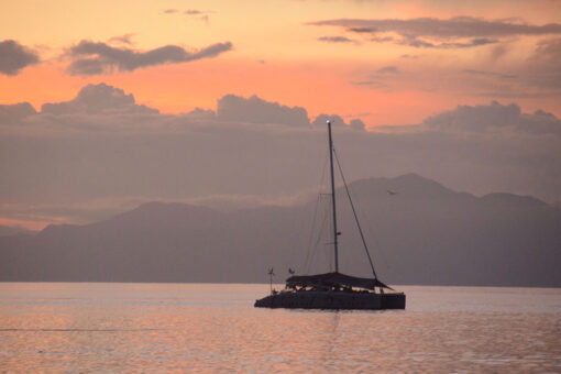 liveaboard sailing catamaran sunset
